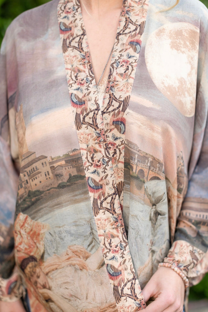 Model wearing the Imaginarium matinee duster featuring a dreamy collage of historic art, candle chandelier, and sleeping muse inspired by Victorian paintings – Market of Stars