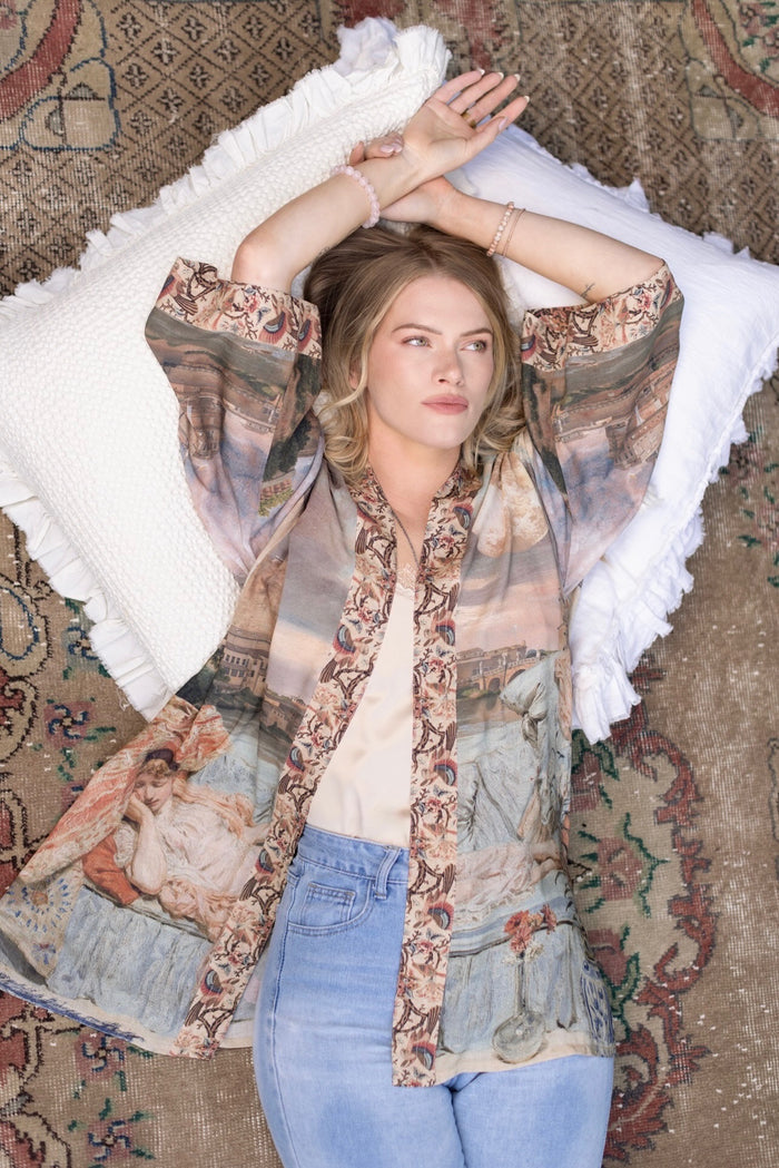 Model wearing the Imaginarium matinee duster featuring a dreamy collage of historic art, candle chandelier, and sleeping muse inspired by Victorian paintings – Market of Stars