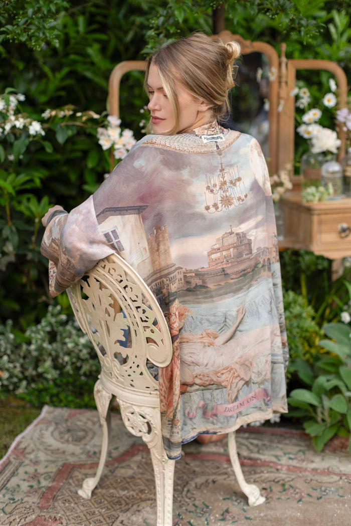 Model wearing the Imaginarium matinee duster featuring a dreamy collage of historic art, candle chandelier, and sleeping muse inspired by Victorian paintings – Market of Stars