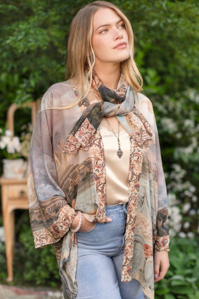 Model wearing the Imaginarium matinee duster featuring a dreamy collage of historic art, candle chandelier, and sleeping muse inspired by Victorian paintings – Market of Stars