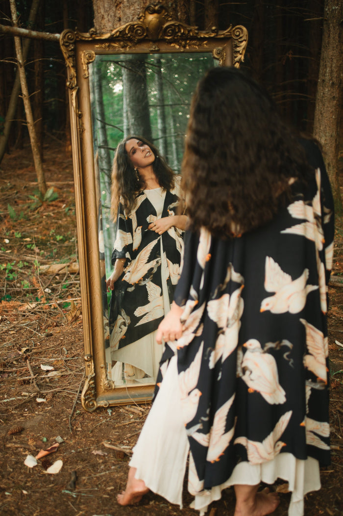 Model wearing the original Market of Stars kimono featuring Victorian-inspired doves and the words “In Stardust We Trust” — a tribute to dreams and possibility – Market of Stars.