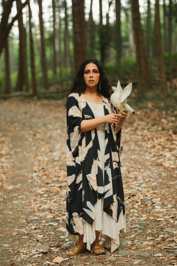 Model wearing the original Market of Stars kimono featuring Victorian-inspired doves and the words “In Stardust We Trust” — a tribute to dreams and possibility – Market of Stars.