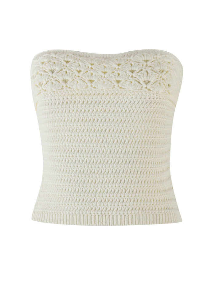 Introducing the JONAS TOP - WHITE : CREAM by TIGERMIST. This cream-colored, strapless crochet bandeau top showcases intricate, floral-like crochet work on the upper part, transitioning to a denser and simpler stitch pattern throughout the rest of its form-fitting design.