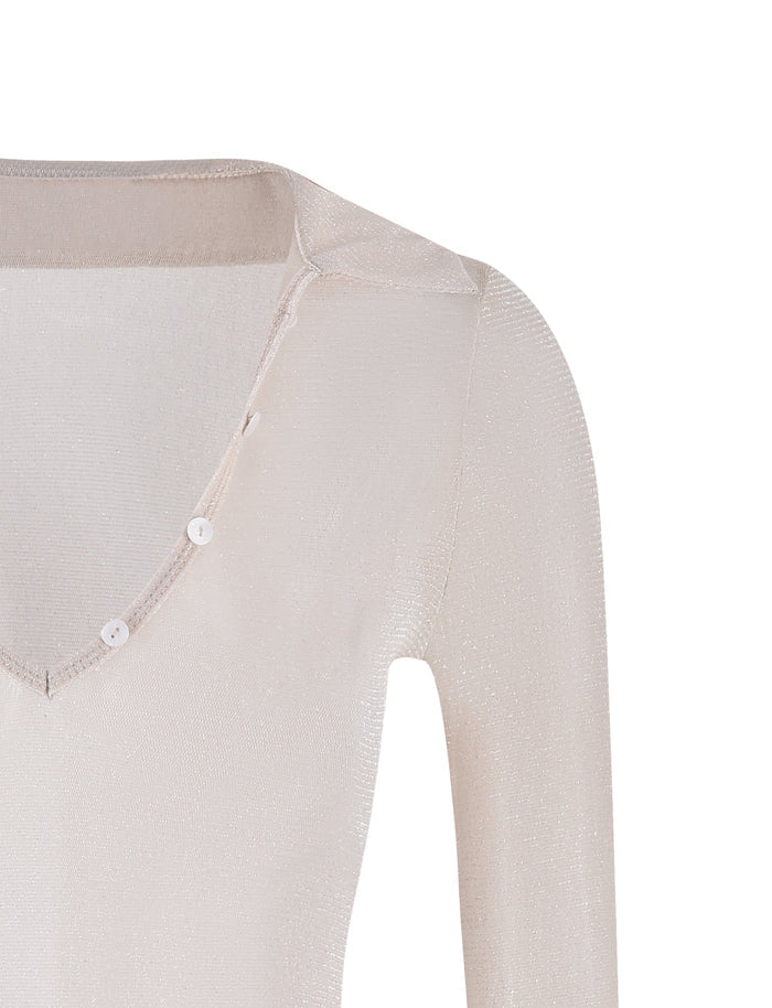 A close-up image of the JOSIAS TOP - WHITE : CREAM from TIGERMIST. This long-sleeved, V-neck top features a light beige hue with a subtle shimmer in the fabric, and three small white buttons adorning the neckline. The top is photographed on a plain white background.