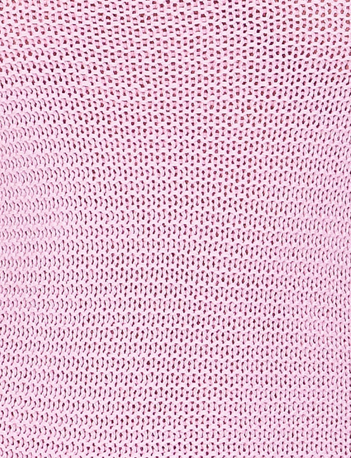 A close-up image of the pink textured woven fabric from the JULANE DRESS by TIGERMIST, showcasing a pattern of small, evenly spaced holes. The fabric appears soft and slightly stretchy, with a consistent knit design throughout.