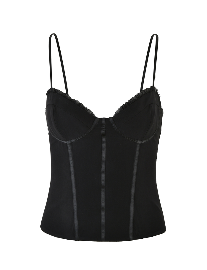 The KAIRA CORSET TOP - BLACK by TIGERMIST features adjustable straps, structured boning, front lace-up detail, and a ruffle-trimmed neckline. Shown in black mesh against a white background.