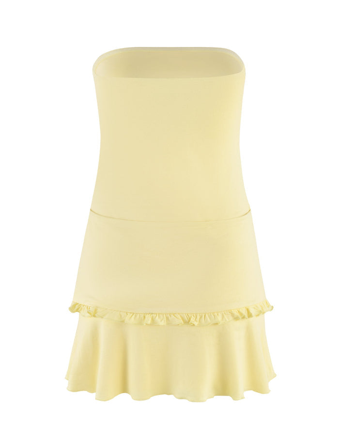 The KATYA DRESS by TIGERMIST, available in pale yellow, is a strapless mini-length dress with a fitted bodice and gently ruffled hem. Made from high-stretch fabric, it showcases a simple yet elegant design perfect for a casual and summery vibe.