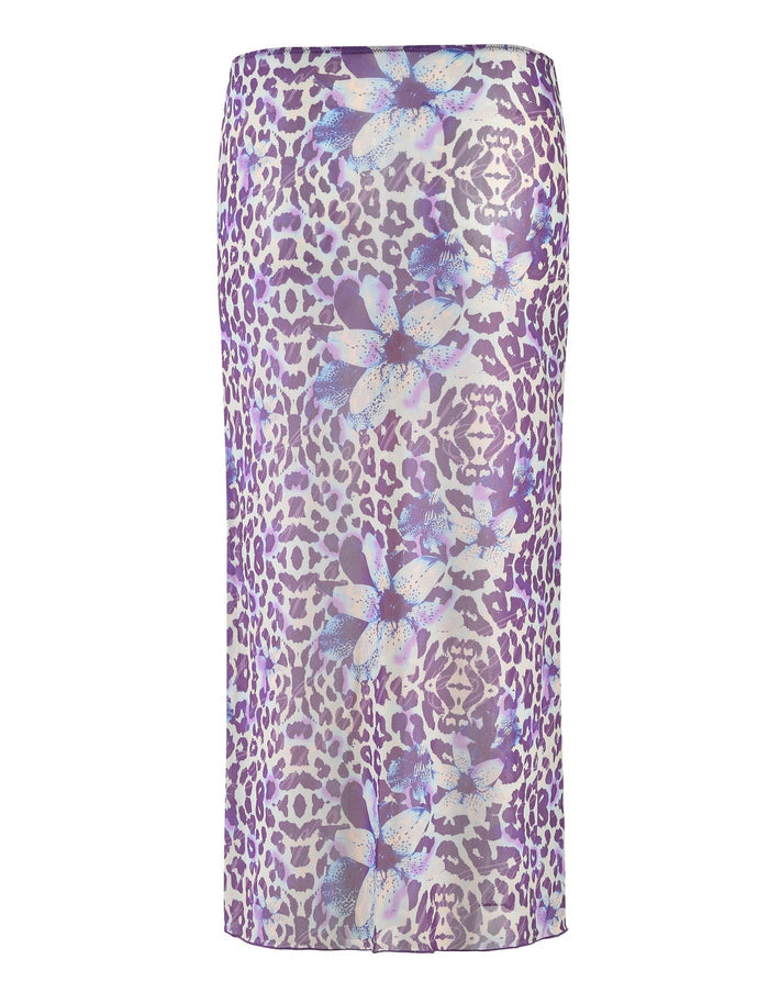 The Kellan Skirt - Purple by Poppy Leopard from Tigermist is a high-waisted, purple midi skirt featuring a striking print of large white and light blue flowers combined with a purple leopard pattern. It has a straight cut and offers a glossy finish.