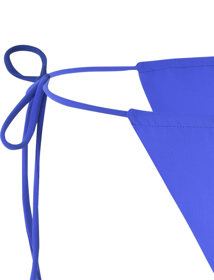 Close-up of the KHESSA Bikini Bottom in Cobalt Blue from TIGERMIST, featuring a simple design with two triangular fabric pieces connected by thin straps. A decorative bow is tied with the straps, adding charm. The fabric texture appears smooth and stretchy.