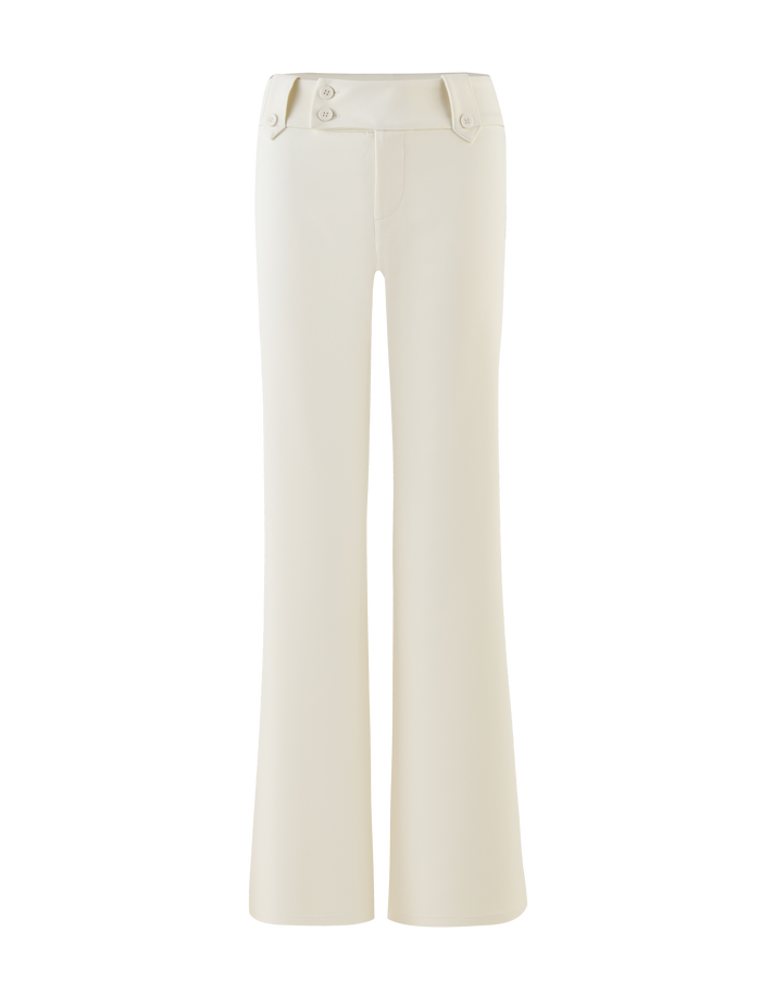 The TIGERMIST KITTIE PANT - WHITE : CREAM is a high-waisted, wide-leg pant with a subtle flare, front leg seams, two waistband buttons, and decorative side flaps.