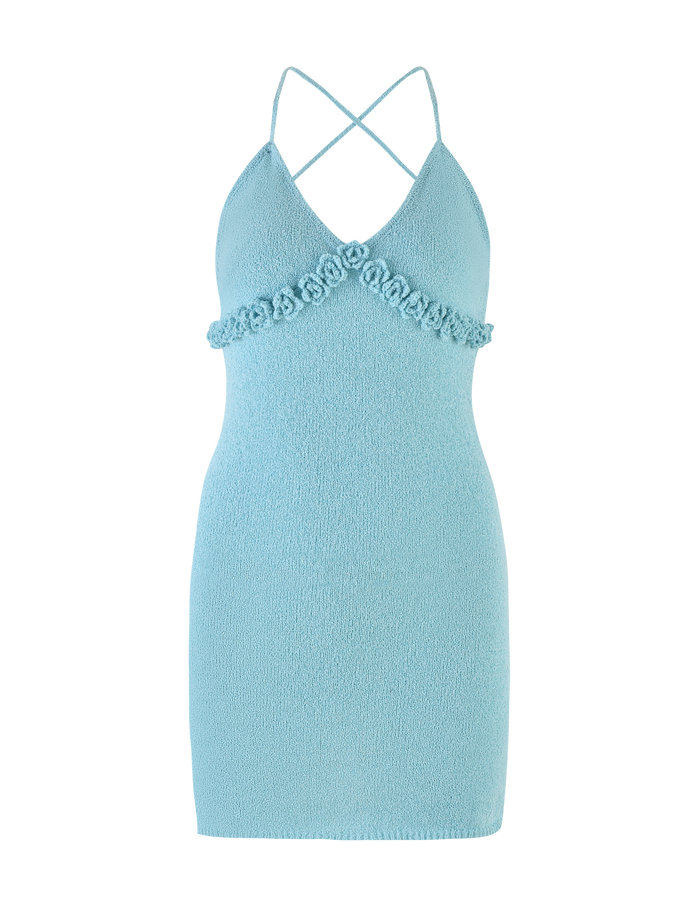 The TIGERMIST LAVELLE MINI DRESS - BLUE is a light blue, sleeveless bodycon mini with a deep V-neck, crisscross back straps, floral embellishments under the bust, and a textured knit for a playful yet chic backless style.