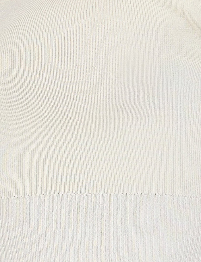 Close-up image of a white ribbed knit fabric, reminiscent of TIGERMIST's LEDGER SKIRT - WHITE : CREAM. The texture is uniform, showcasing vertical lines and a stretchy quality, typical of knitted garments. The lighting is even, highlighting the fabric's structure and detail.