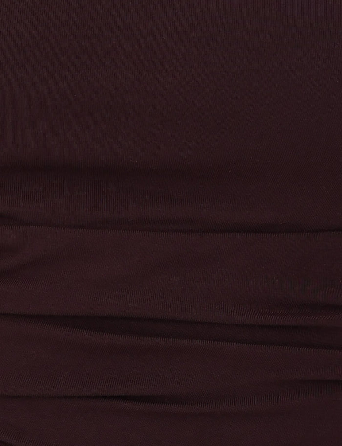 Close-up view of the LEILANI TOP - BROWN : CHOCOLATE by TIGERMIST, featuring dark brown ruched fabric with a buttery jersey texture and horizontal folds.