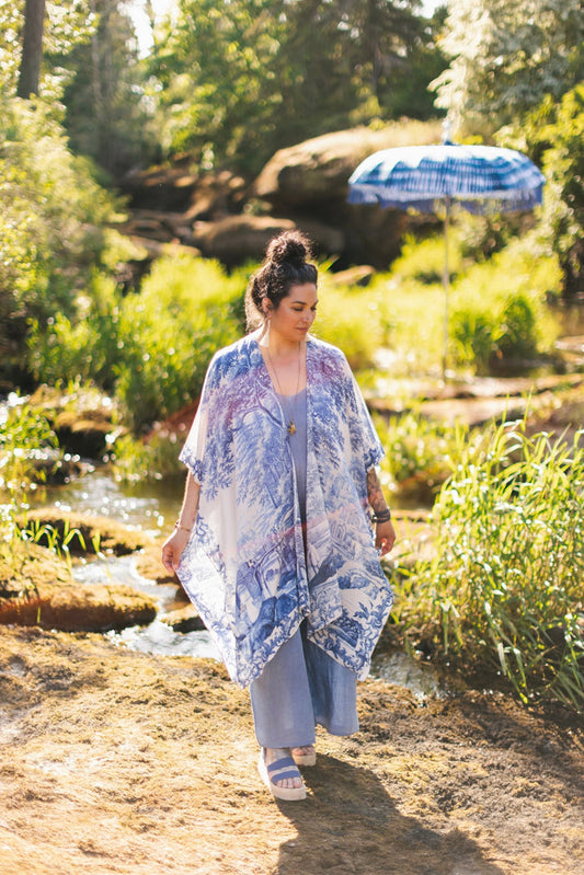 Model wearing Let the Light In Goddess kimono duster featuring print of Delft blue and white landscape pottery, and positive message of light and hope - Market of Stars
