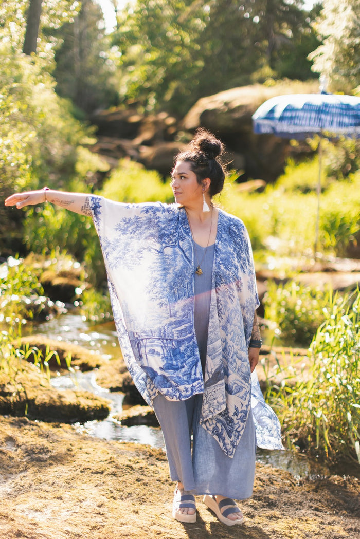 Model wearing Let the Light In Goddess kimono duster featuring print of Delft blue and white landscape pottery, and positive message of light and hope - Market of Stars