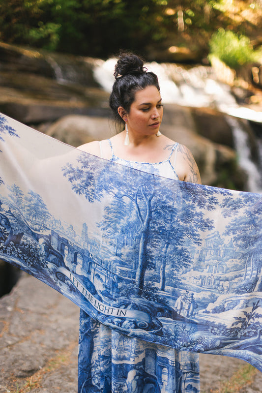 Let the Light In airy bamboo viscose scarf featuring print of Delft blue and white pottery, and positive message of light and hope - Market of Stars
