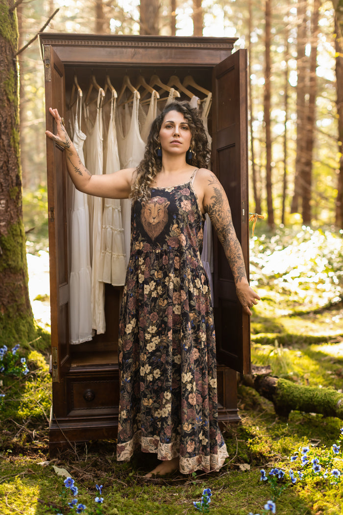 Model wearing a maxi-length slip dress in a floral print ft. artwork by artist & illustrator Jessica Roux - Market of Stars