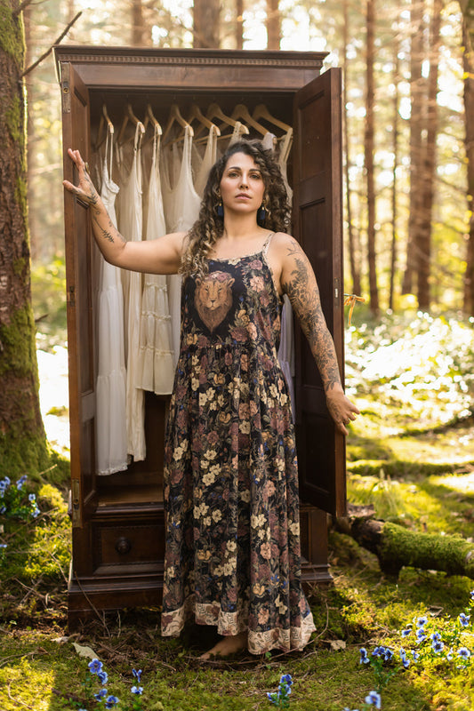 Model wearing a maxi-length slip dress in a floral print ft. artwork by artist & illustrator Jessica Roux - Market of Stars