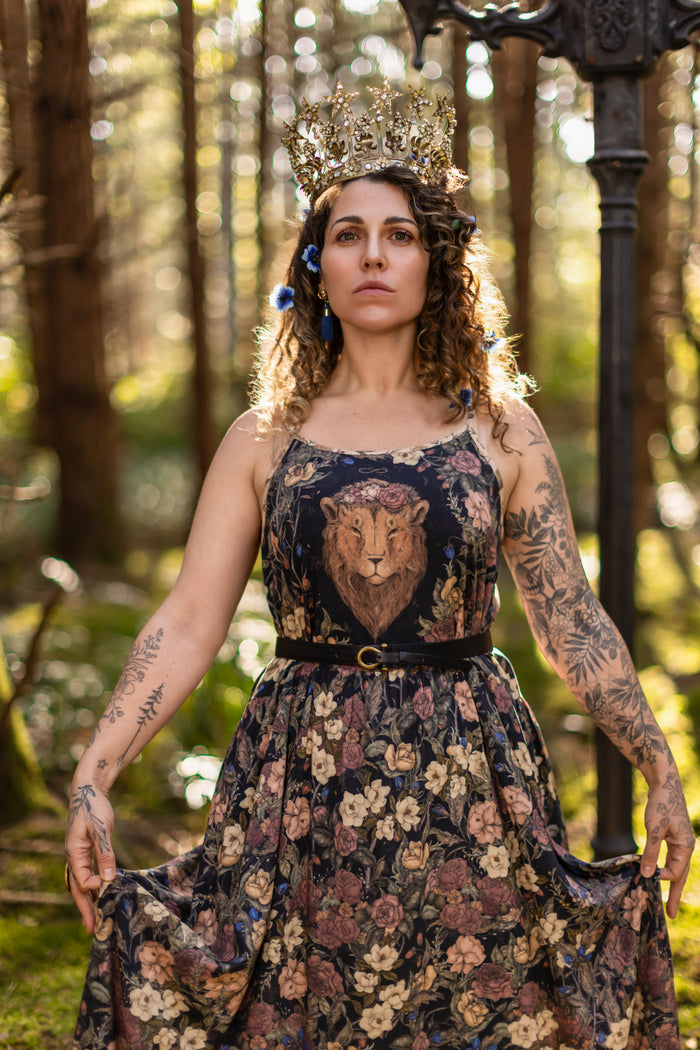 Model wearing a maxi-length slip dress in a floral print ft. artwork by artist & illustrator Jessica Roux - Market of Stars