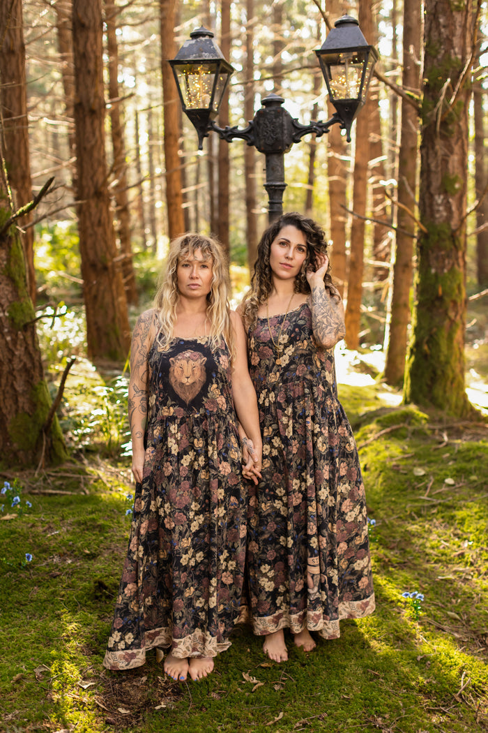Model wearing a maxi-length slip dress in a floral print ft. artwork by artist & illustrator Jessica Roux - Market of Stars