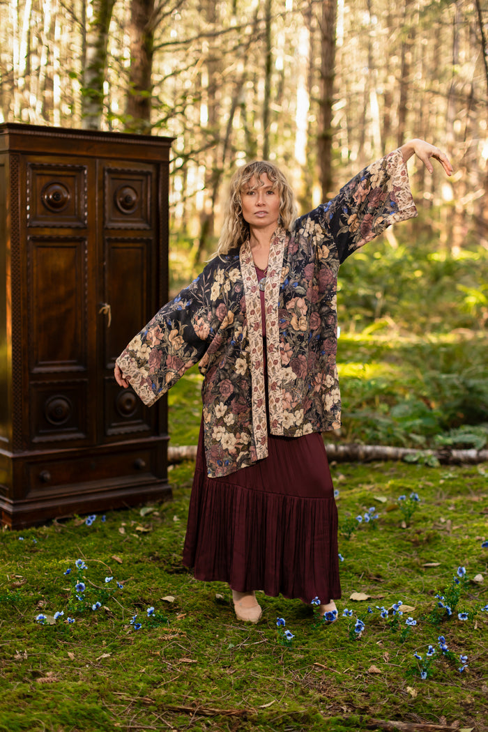 Model wearing a mid-length floral duster ft. artwork by artist & illustrator Jessica Roux - Market of Stars