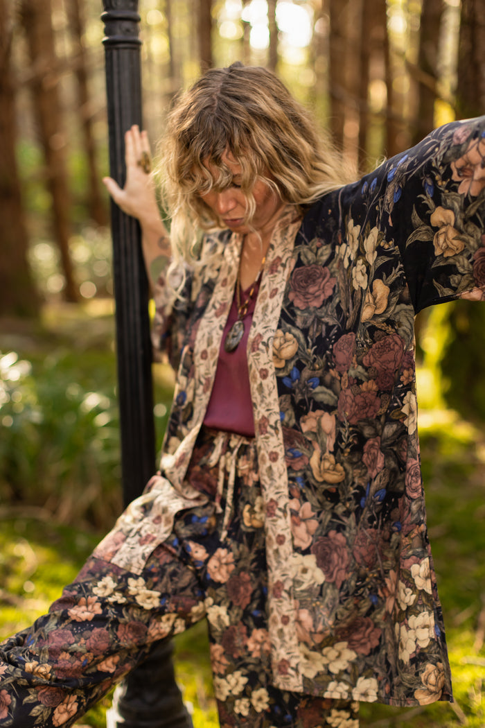 Model wearing a mid-length floral duster ft. artwork by artist & illustrator Jessica Roux - Market of Stars
