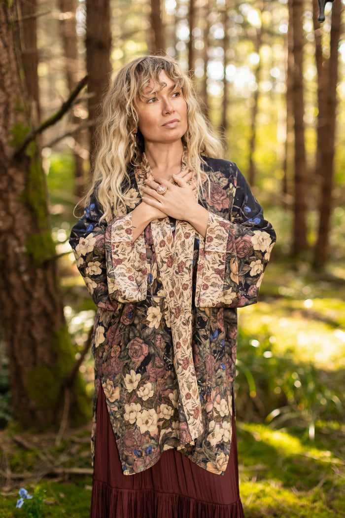 Model wearing a mid-length floral duster ft. artwork by artist & illustrator Jessica Roux - Market of Stars