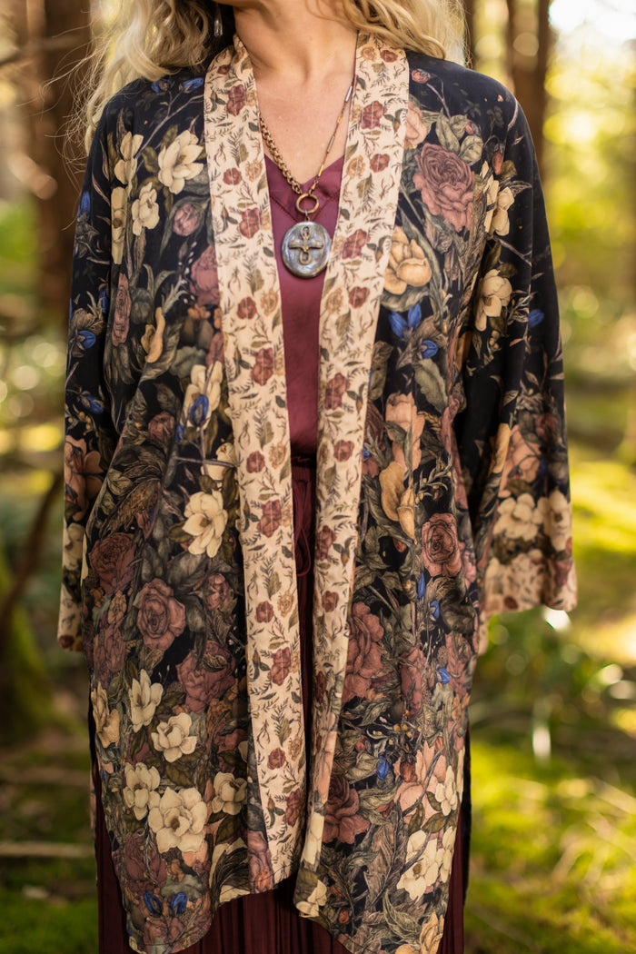 Model wearing a mid-length floral duster ft. artwork by artist & illustrator Jessica Roux - Market of Stars