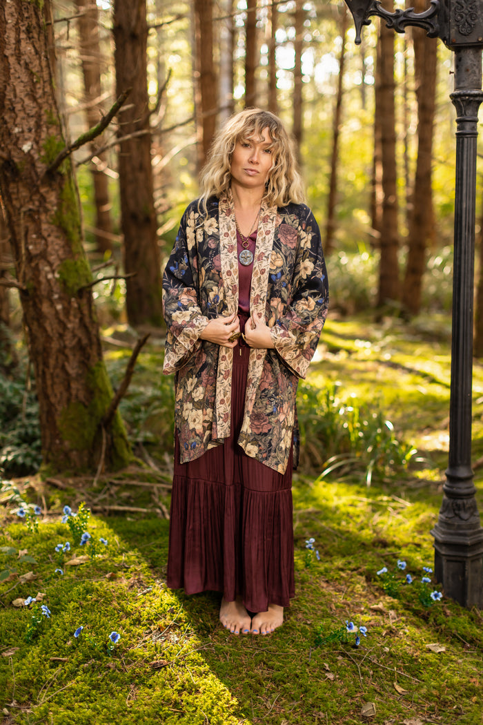 Model wearing a mid-length floral duster ft. artwork by artist & illustrator Jessica Roux - Market of Stars
