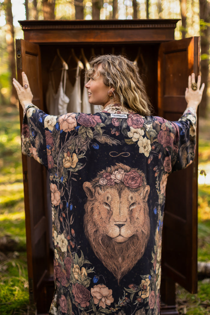 Model wearing a full-length floral duster ft. artwork by artist & illustrator Jessica Roux - Market of Stars
