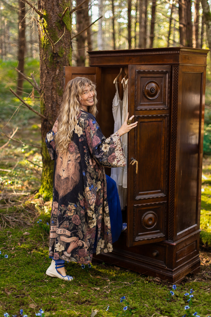 Model wearing a full-length floral duster ft. artwork by artist & illustrator Jessica Roux - Market of Stars