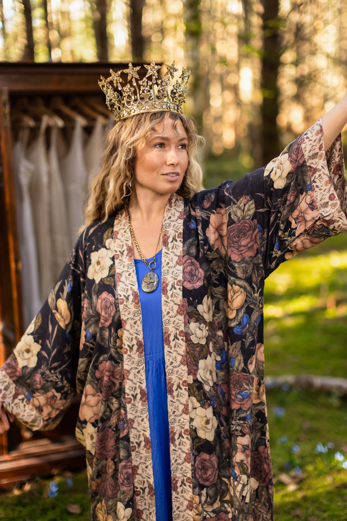 Model wearing a full-length floral duster ft. artwork by artist & illustrator Jessica Roux - Market of Stars