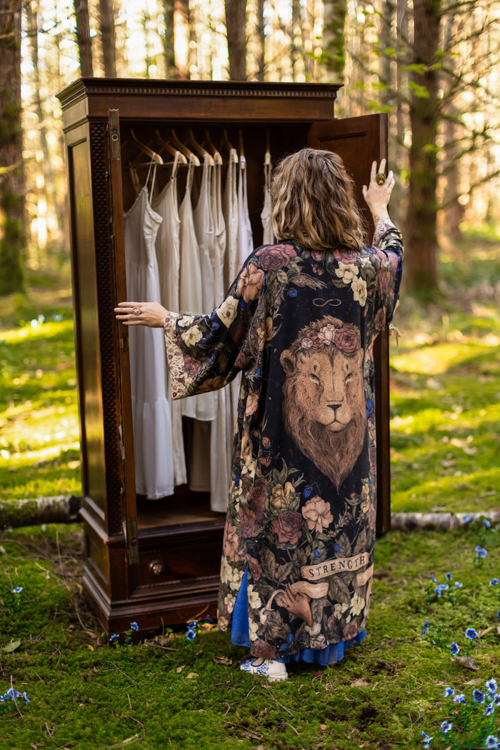 Model wearing a full-length floral duster ft. artwork by artist & illustrator Jessica Roux - Market of Stars