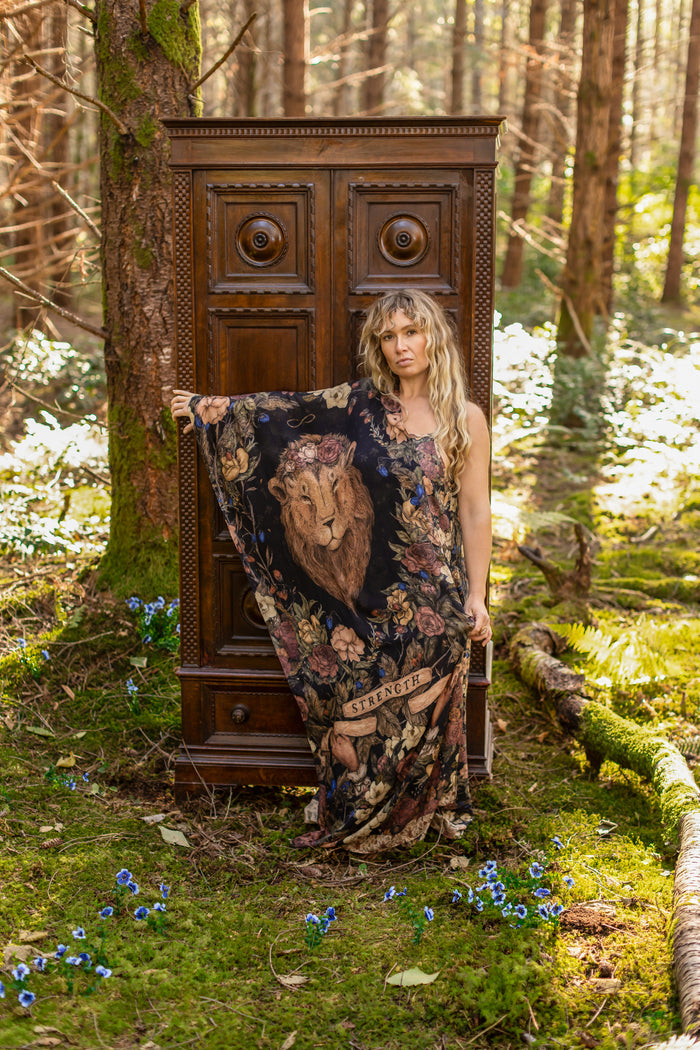 Model wearing a bamboo viscose scarf ft. artwork by artist & illustrator Jessica Roux - Market of Stars