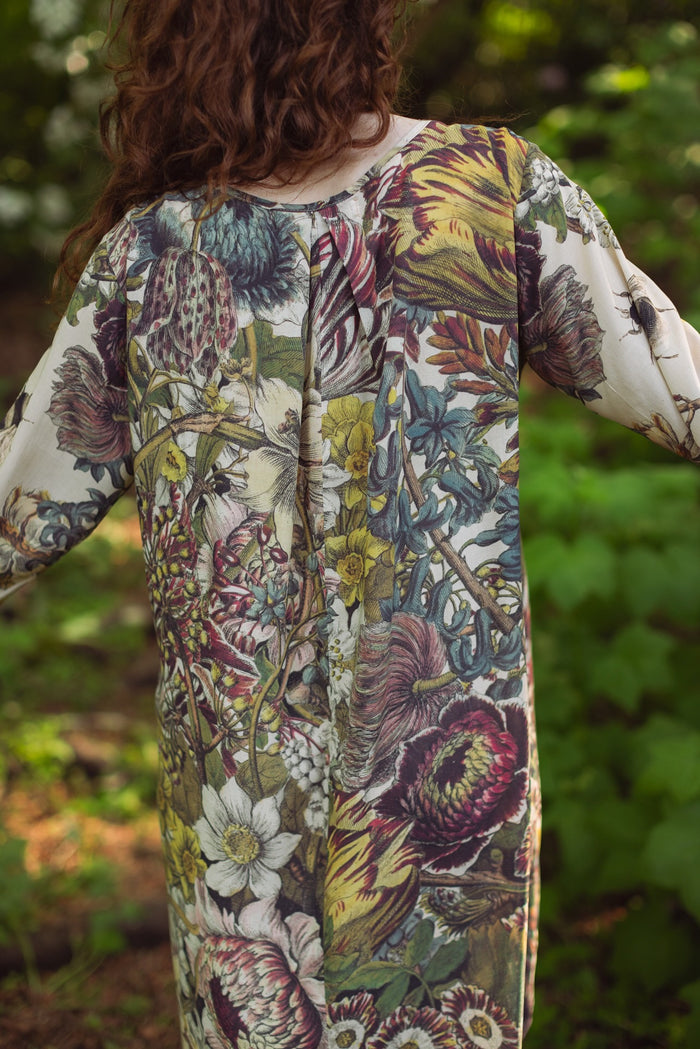 Model styled in Love Grows Wild Artist Dress featuring hand-coloured 1700s floral etchings and bumblebee detail – inspired by the French chemise – Market of Stars