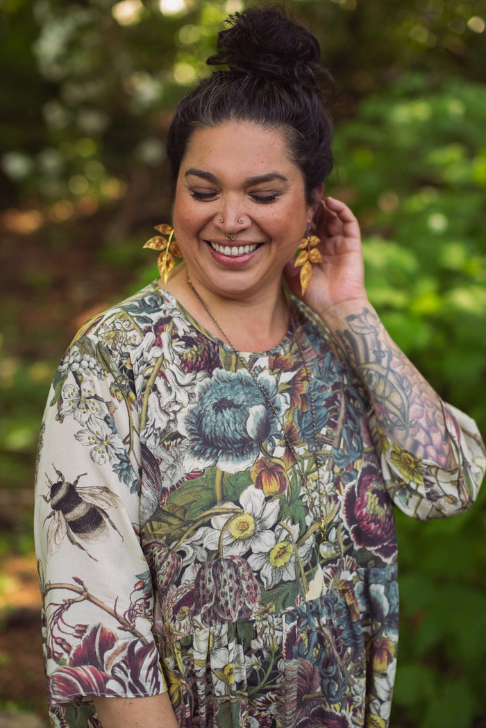 Model styled in Love Grows Wild Artist Dress featuring hand-coloured 1700s floral etchings and bumblebee detail – inspired by the French chemise – Market of Stars