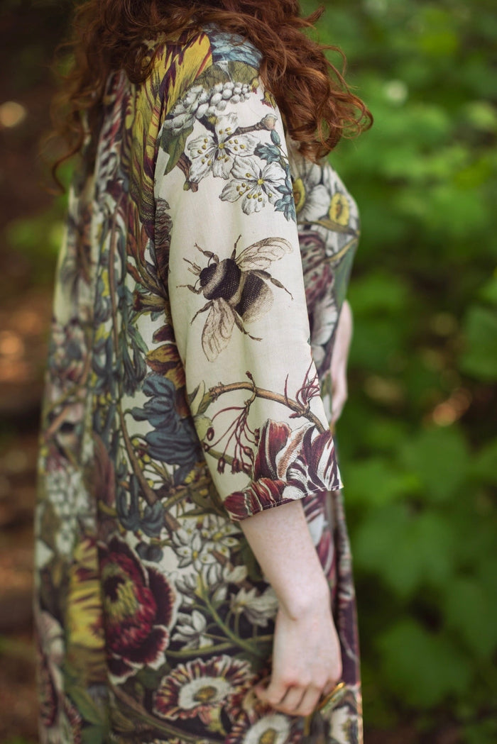 Model styled in Love Grows Wild Artist Dress featuring hand-coloured 1700s floral etchings and bumblebee detail – inspired by the French chemise – Market of Stars