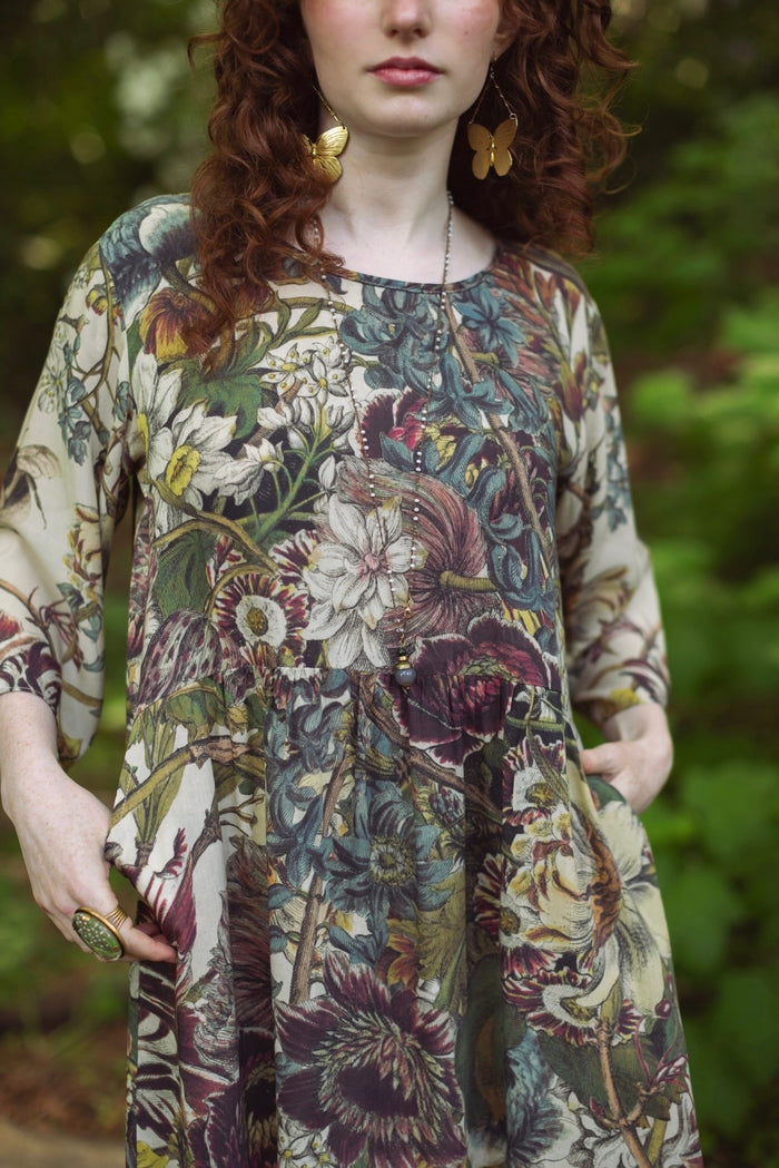 Model styled in Love Grows Wild Artist Dress featuring hand-coloured 1700s floral etchings and bumblebee detail – inspired by the French chemise – Market of Stars