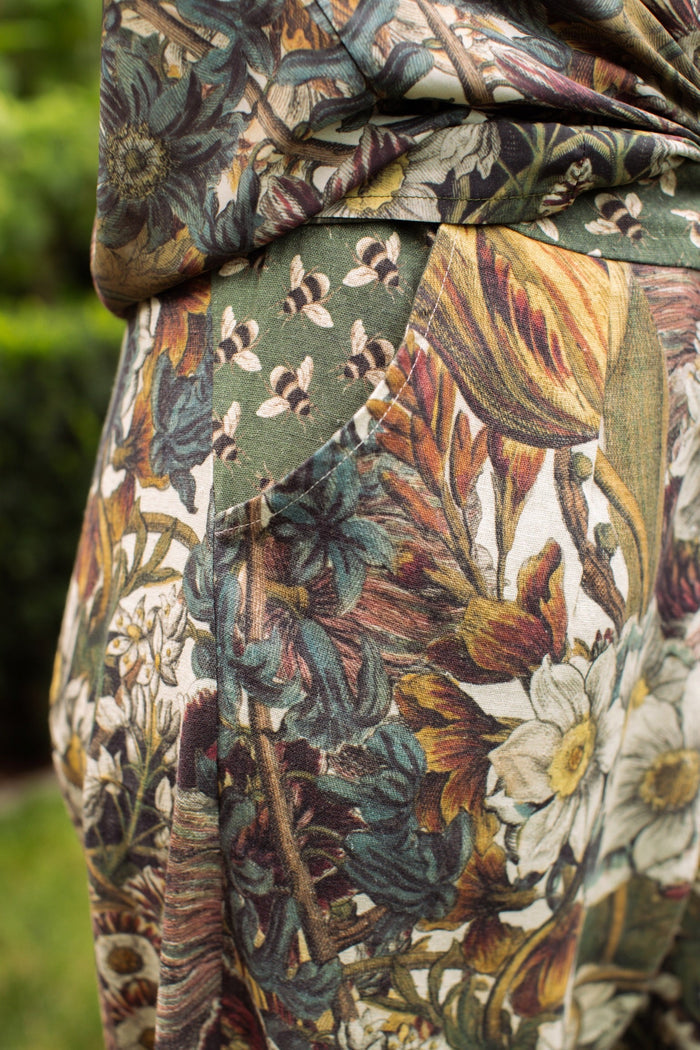 Model styled in Love Grows Wild Artist Pants featuring 1700s hand-coloured floral etchings and bumblebee trim – relaxed lantern hem and cropped fit – Market of Stars