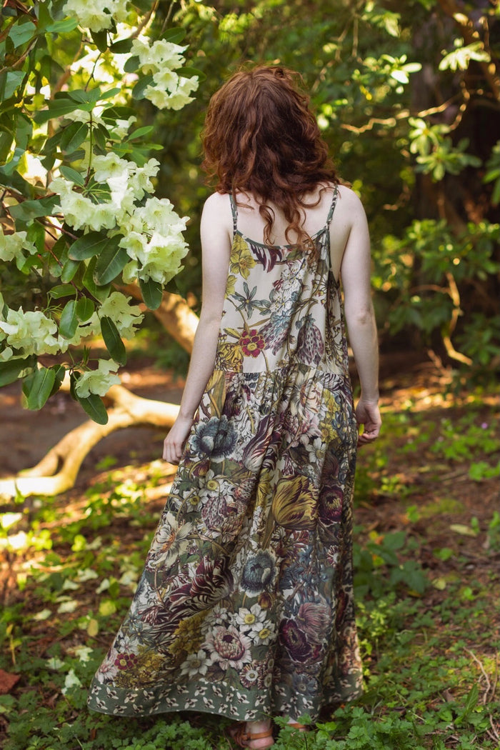 Model wearing Love Grows Wild Bohéme Slip Dress featuring hand-coloured 1700s botanical etchings and bumblebee detail – adjustable, flowy, and reversible – Market of Stars.
