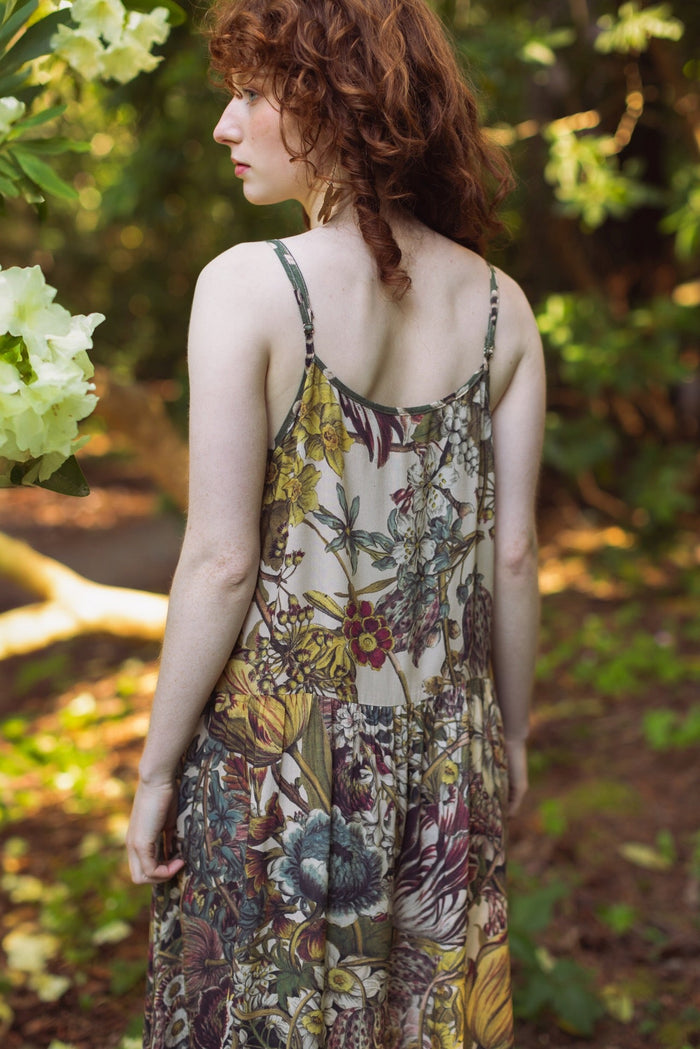 Model wearing Love Grows Wild Bohéme Slip Dress featuring hand-coloured 1700s botanical etchings and bumblebee detail – adjustable, flowy, and reversible – Market of Stars.