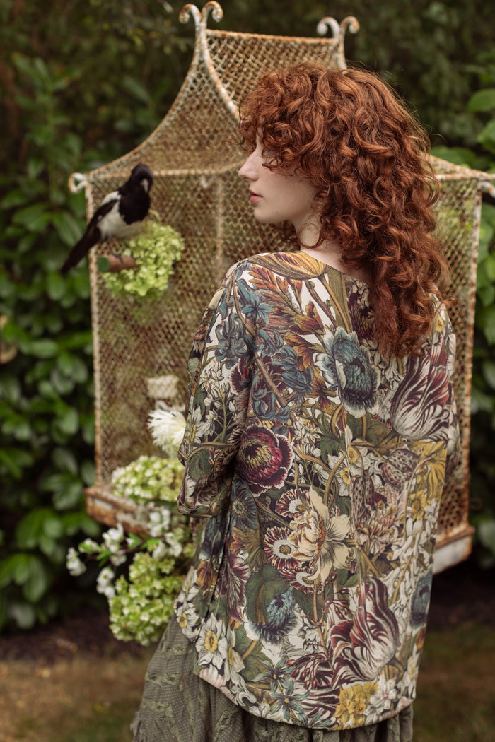 Model wearing the Love Grows Wild Luxe Tee featuring lush floral etchings inspired by 1700s botanical art with hidden bee trim detail – Market of Stars.