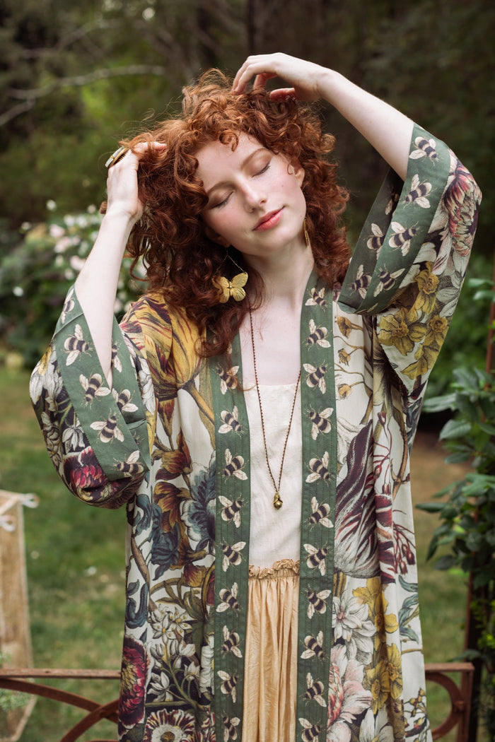 Model wearing kimono featuring 1700s March floral etchings and charming bumblebee trim inspired by vintage seed catalogues – Market of Stars.