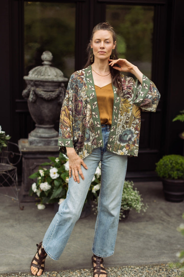 Model wearing Love Grows Wild Pixie Duster featuring hand-coloured 1700s floral etchings and charming bumblebee trim, celebrating the joy of abundance – Market of Stars.
