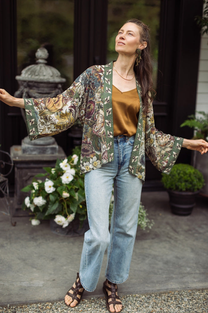 Model wearing Love Grows Wild Pixie Duster featuring hand-coloured 1700s floral etchings and charming bumblebee trim, celebrating the joy of abundance – Market of Stars.