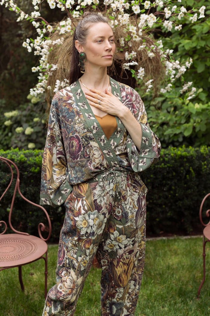 Model wearing Love Grows Wild Pixie Duster featuring hand-coloured 1700s floral etchings and charming bumblebee trim, celebrating the joy of abundance – Market of Stars.