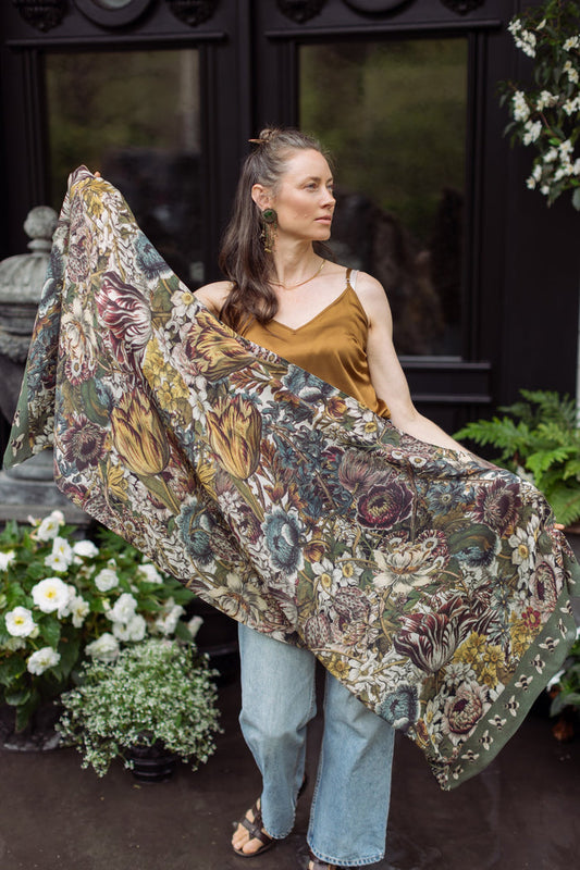 Model wearing soft viscose scarf featuring 1700s March botanical etchings and bumblebee trim from vintage seed catalogue – Market of Stars.