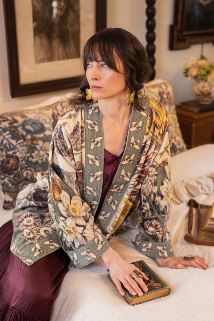 Model wearing a soft cotton velvet duster featuring lush 1700s botanical blooms and bumblebee trim - Market of Stars