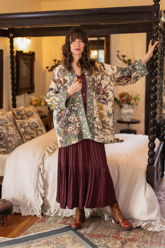 Model wearing a soft cotton velvet duster featuring lush 1700s botanical blooms and bumblebee trim - Market of Stars