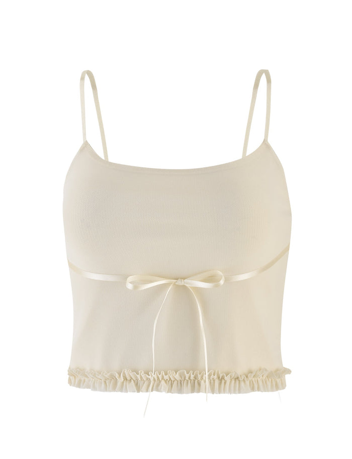 The MAISIE TOP by TIGERMIST is a pale yellow, sleeveless crop top featuring adjustable straps, a satin front bow, and a ruffled hem for extra frill.